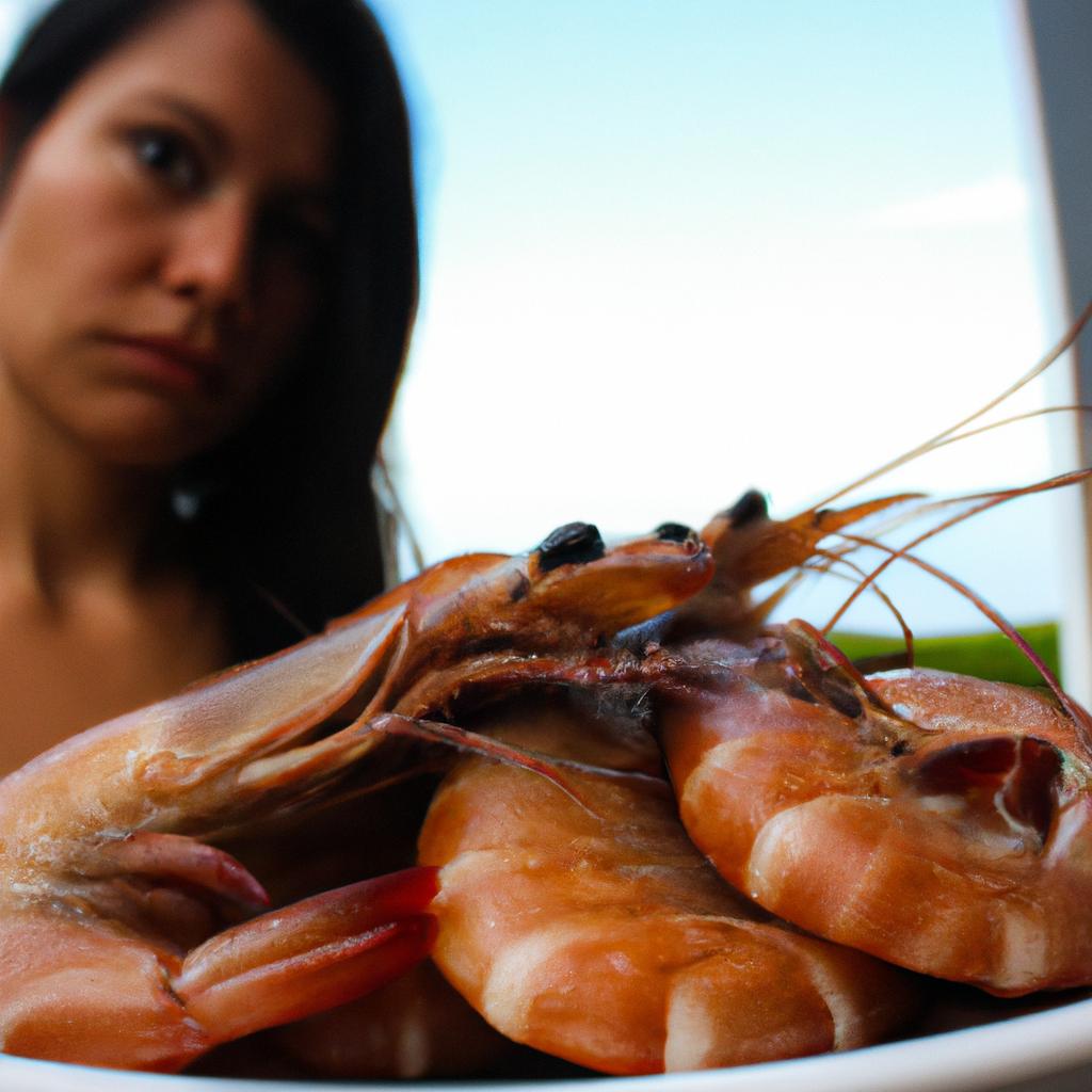 Woman holding a plate of shrimp