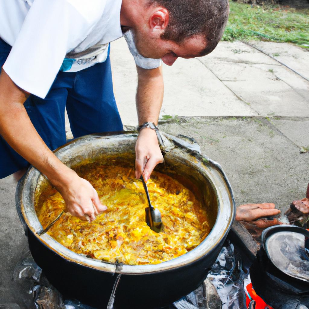 Man cooking traditional dish outdoors